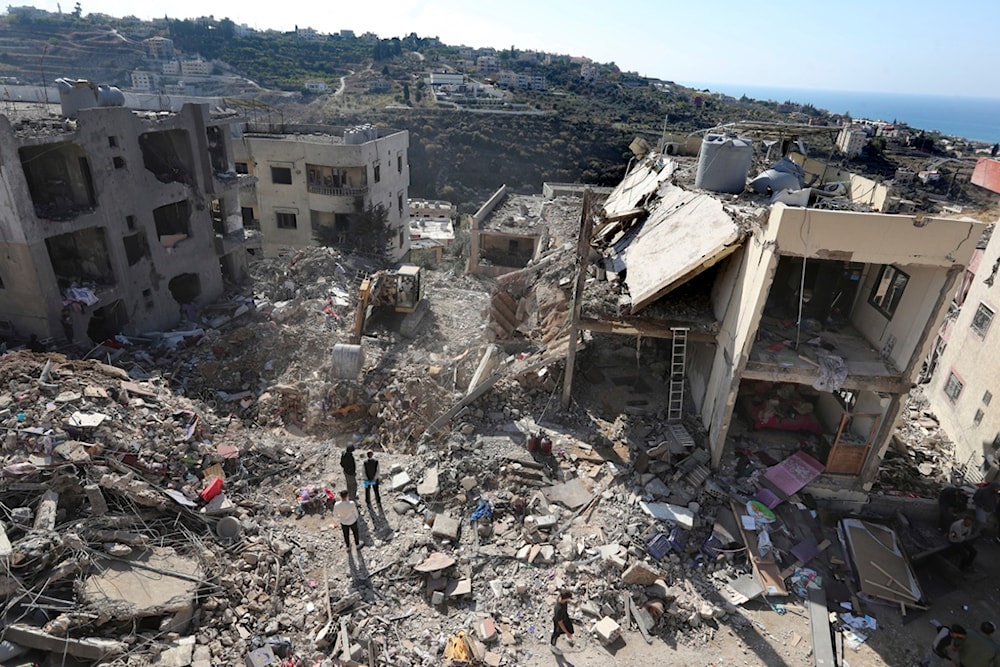 Civil defense workers check the site of a building that collapsed after it was hit by an Israeli airstrike in Hadath, south of Beirut, Lebanon, Sunday, Nov. 17, 2024. (AP)