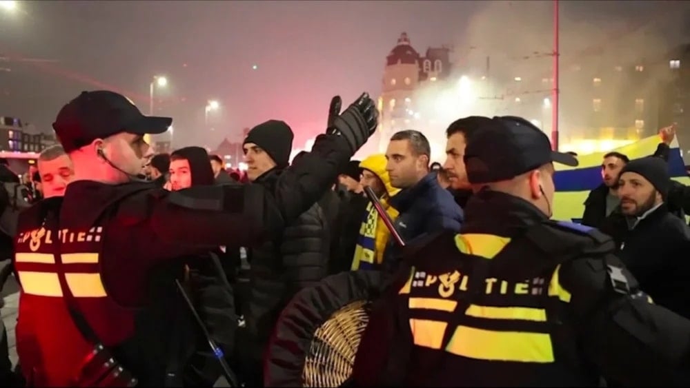  Police escort Maccabi Tel Aviv supporters to the metro station leading the Ajax stadium, after pro- Palestinian supporters marched near the stadium in Amsterdam, Netherlands, November 7, 2024. (AP)