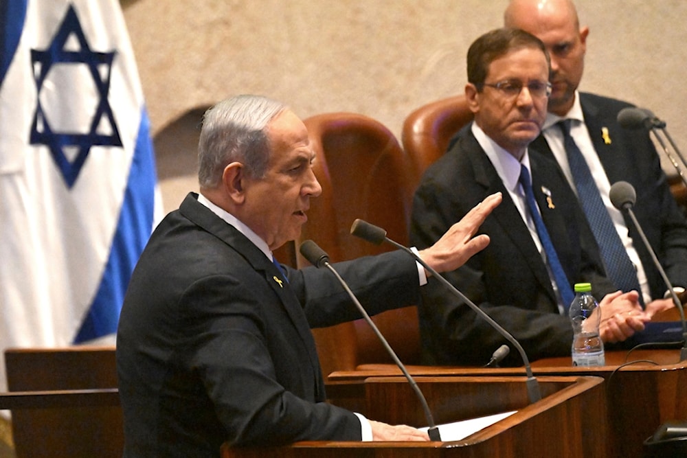 Israeli Prime Minister Benjamin Netanyahu speaks at the opening of the 25th Knesset session, in occupied al-Quds, Monday, Oct. 28, 2024. (AP)