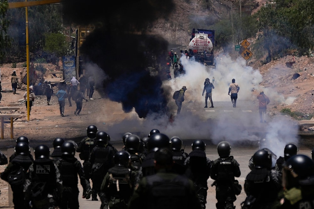 Police launch tear gas to disperse supporters of former President Evo Morales who have been blocking roads for days to prevent him from facing a criminal investigation, Bolivia, Friday, Nov. 1, 2024. (AP)