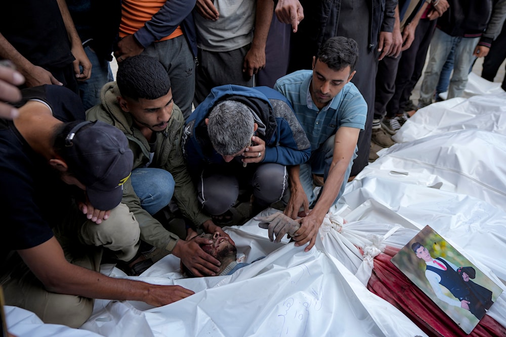 Palestinians mourn their relatives killed in the Israeli bombardment of the Gaza Strip at a hospital morgue in Deir al-Balah, on November 1, 2024. (AP)