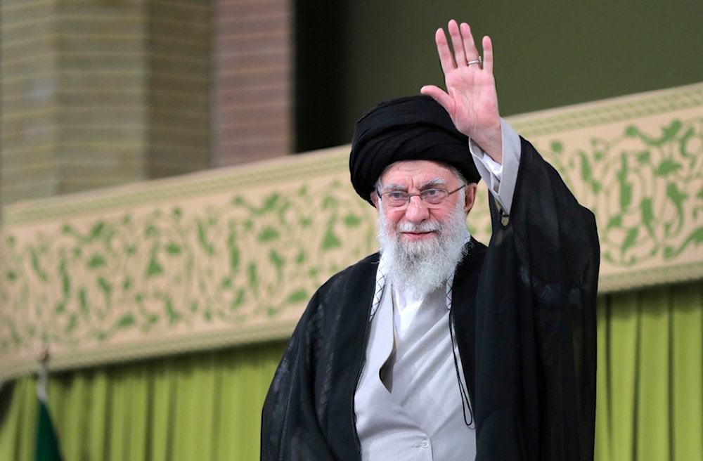 Leader Sayyed Ali Khamenei waves to the crowd during a meeting with school and university students, in Tehran, Iran, Saturday, Nov. 2, 2024. (Office of the Iranian Supreme Leader via AP)