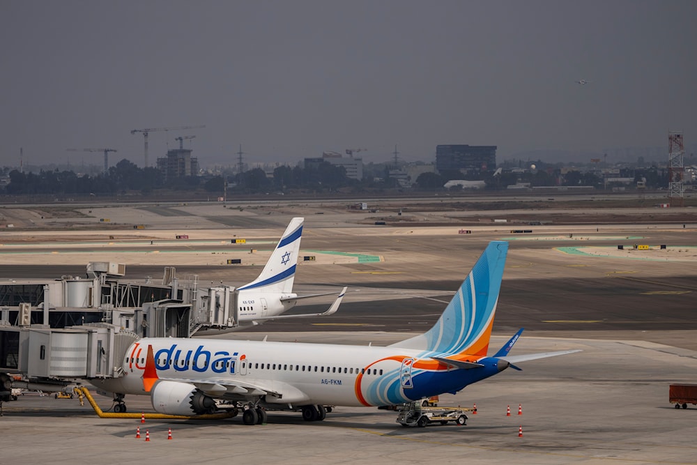 A Fly Dubai plane is parked on the tarmac at Ben Gurion International Airport near Lod, occupied Palestine on November 10, 2024. (AP)