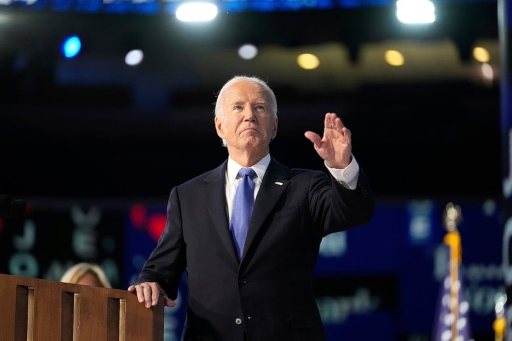 US President Joe Biden waves during the Democratic National Convention on Monday August 19,2024, in Chicago. (AP)