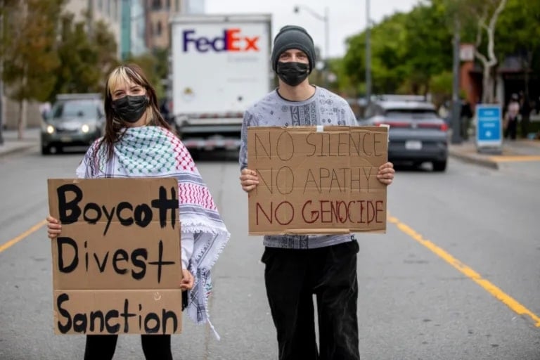  Student protesters outside of UC San Francisco’s Rutter Center call for the UC system to divest from investments in Israeli companies as the UC Board of Regents holds meetings inside the university, in San Francisco, on July 17, 2024. (AP