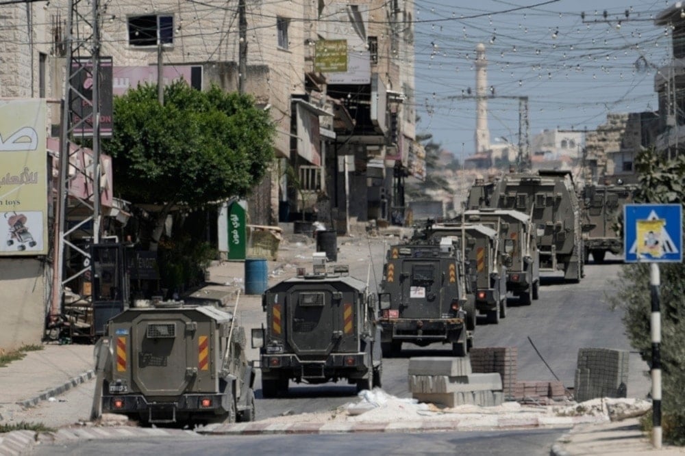 A column of Israeli armored vehicles withdrew following the storming of the Tubas town in the occupied West Bank on Wednesday, August 14, 2024. (AFP)