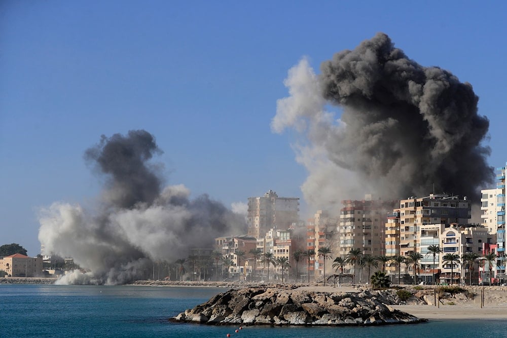 Smoke rises from buildings hit in Israeli airstrikes in Tyre, southern Lebanon, on October 28, 2024. (AP)