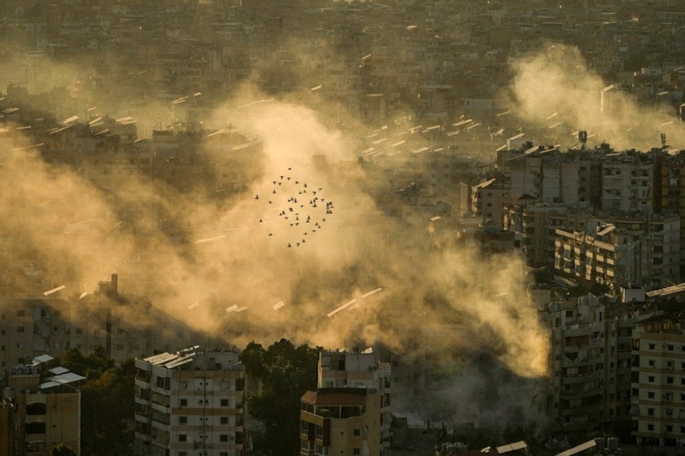 A flock of birds flies as smoke rises from the site of an Israeli airstrike in Dahiyeh, in the southern suburb of Beirut, Lebanon, Thursday, October 24, 2024. (AP)