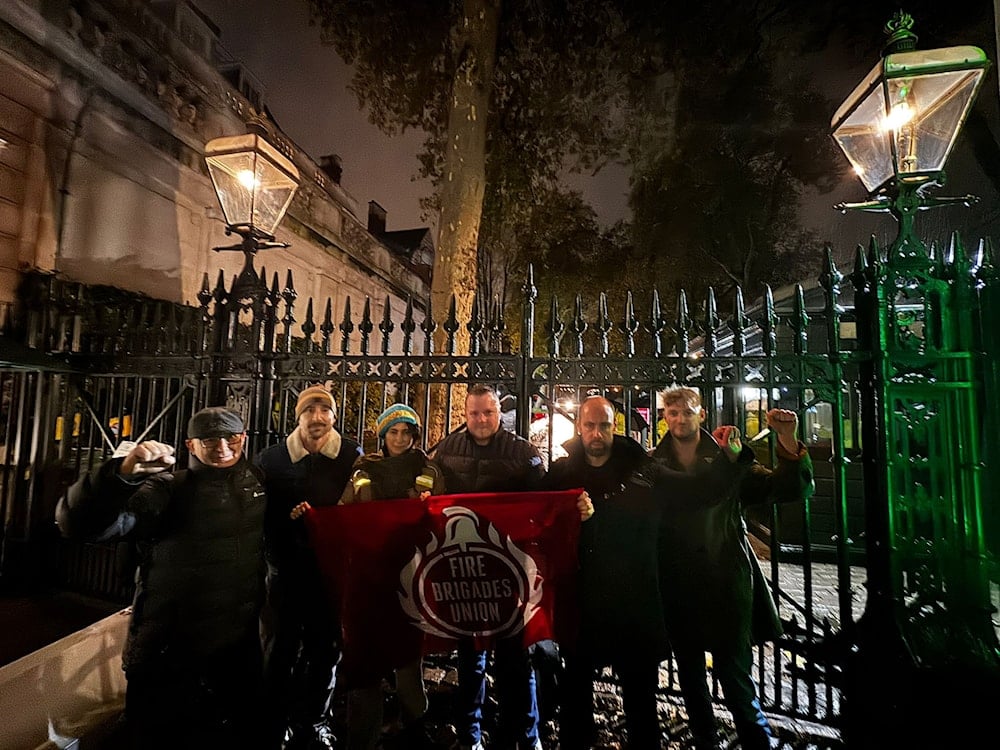 British firefighters demand donation release outside Israeli embassy