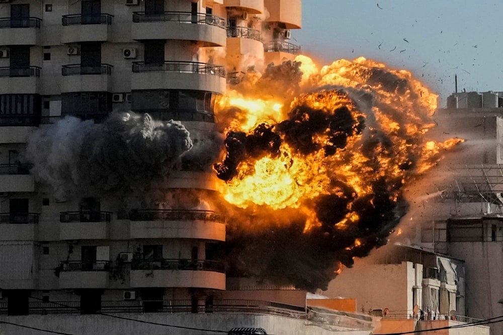 Smoke and flames erupt from a building hit in an Israeli airstrike in Chiyah, in the southern suburb of Beirut, Lebanon, Friday, Nov. 22, 2024. (AP)