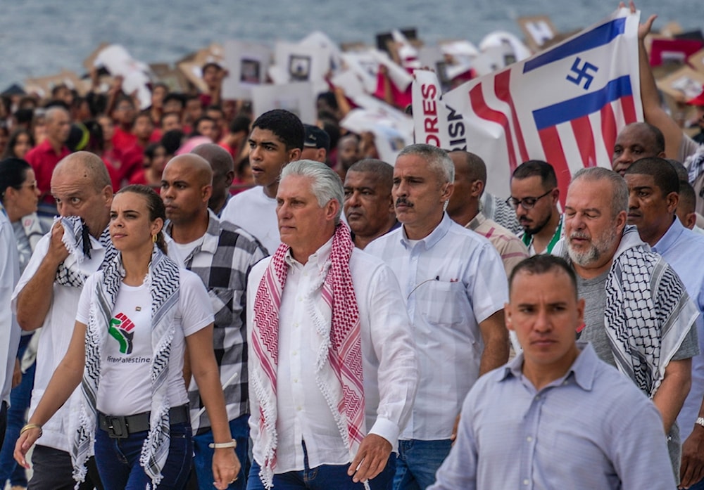 Cuban President Miguel Diaz-Canel, center, marches in support of the Palestinian people amid the Israel-Hamas war, in Havana, Monday, October 14, 2024 (AP)