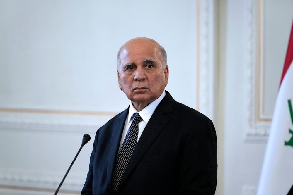 Iraqi Foreign Minister Fuad Hussein listens to his late Iranian counterpart Hossein Amirabdollahian during their joint news briefing in Tehran, Iran, Sept. 13, 2023. (AP)