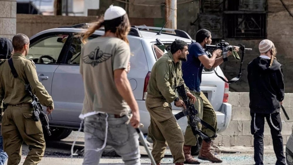   Israeli settlers fire at Palestinians in the West Bank on October 12, 2022. (AFP)