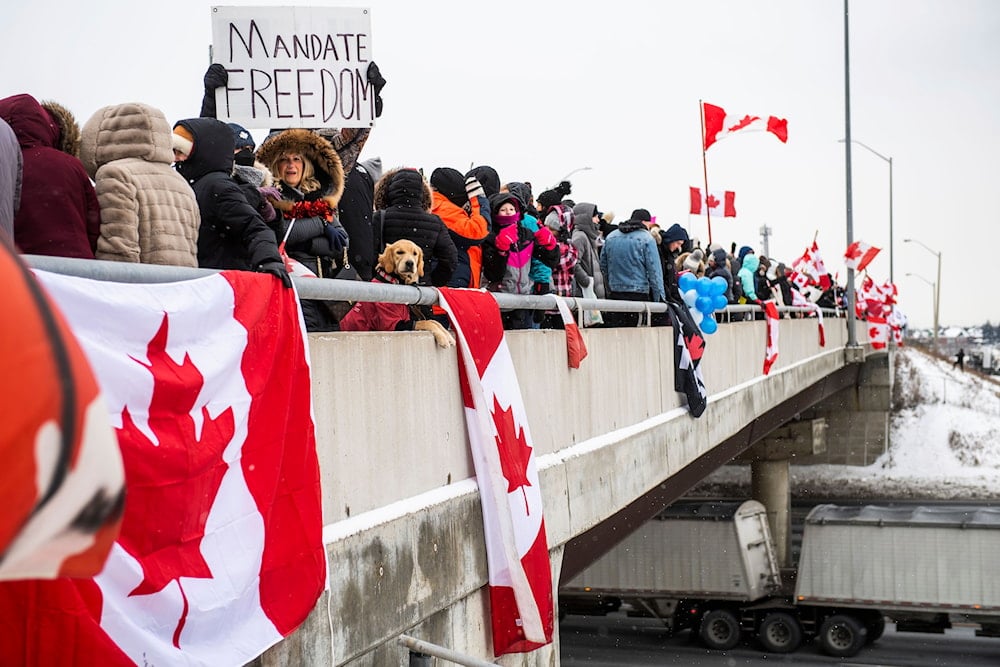 Protestors show their support for the Freedom Convoy of truck drivers who are making their way to Ottawa to protest against COVID-19 vaccine mandates by the Canadian government on January 27, 2022, in Vaughan. (AP)