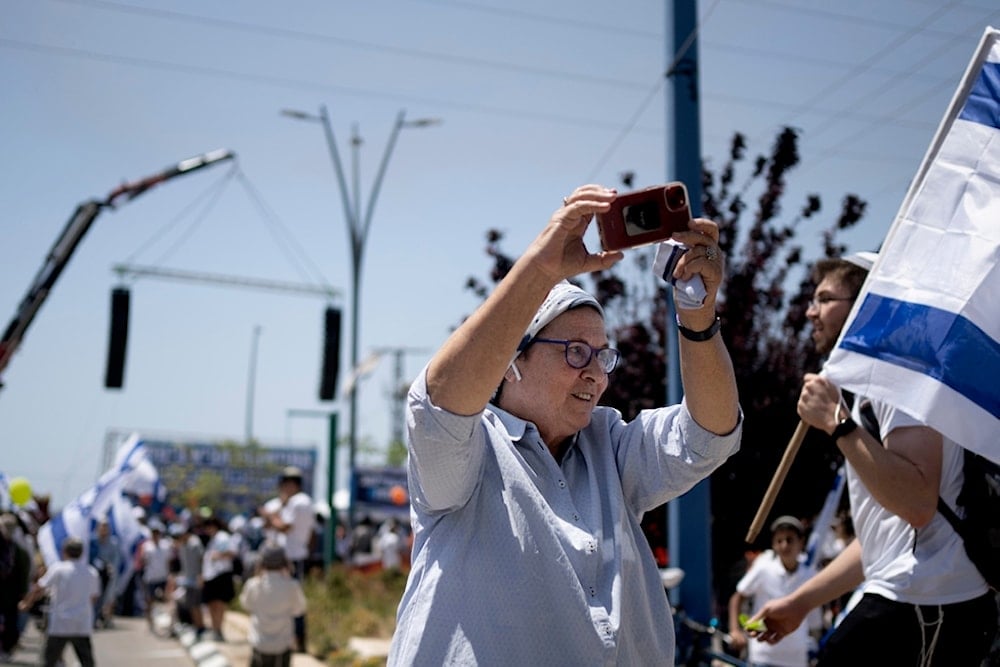 Far-right Israeli settler Daniella Weiss takes part in a march in Sderot, southern occupied Palestine, Tuesday, May 14, 2024 (AP)