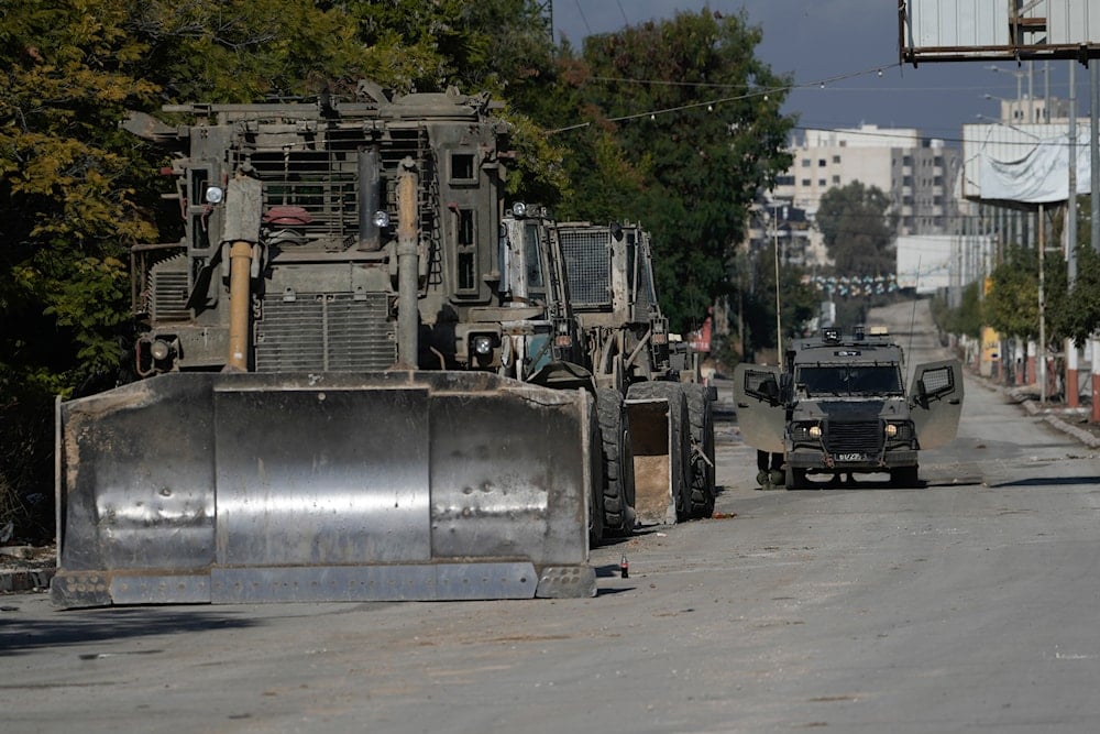 Israeli bulldozers and vehicle is seen during a military operation in the West Bank of Jenin, on November 20, 2024. (AP)