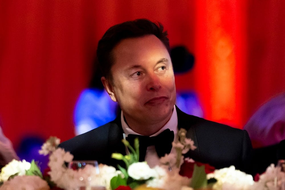 Elon Musk watches before President-elect Donald Trump speaks during an America First Policy Institute gala at his Mar-a-Lago estate, Thursday, Nov. 14, 2024, in Palm Beach, Fla. (AP)