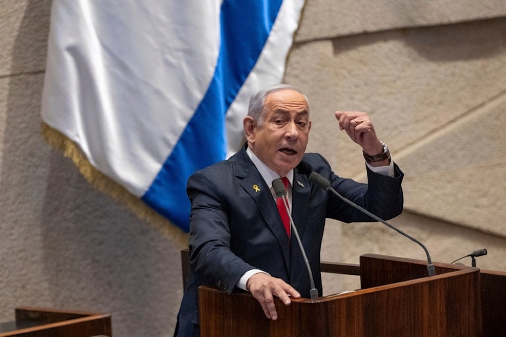 Israeli Prime Minister Benjamin Netanyahu addresses lawmakers in the Knesset in occupied al-Quds, occupied Palestine, Monday, Nov. 18, 2024 (AP)