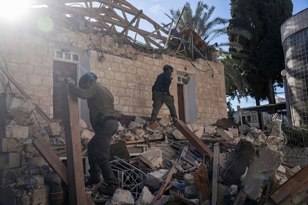 Israeli occupation forces check a house hit by a rocket fired from Lebanon on Saturday, in Haifa, 'Israel', Nov. 17, 2024. (AP)