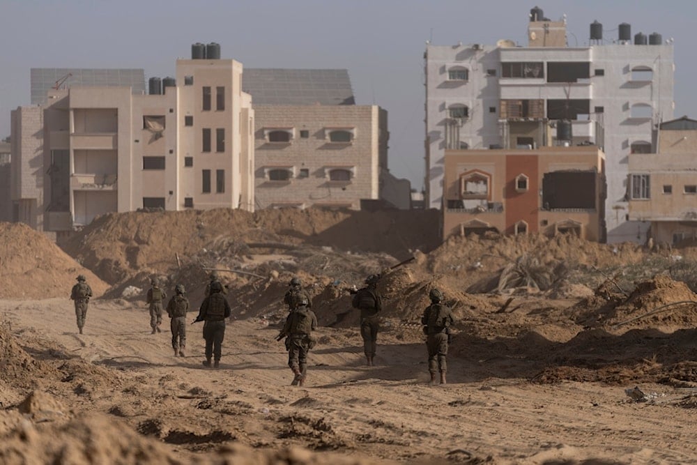 Israeli occupation forces walk during a ground incursion in Khan Younis, Gaza Strip, Palestine, on, Jan. 10. 2024. (AP)