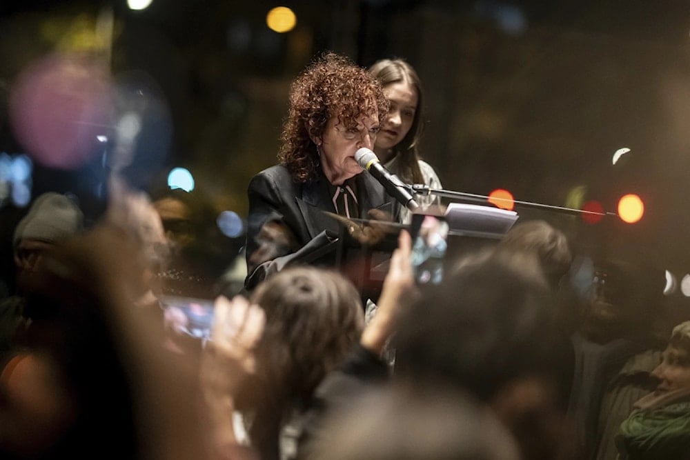 Nan Goldin speaks at the opening of her exhibtion at the Neue Nationalgalerie museum in Berlin, Friday November 22,2024. (AP)