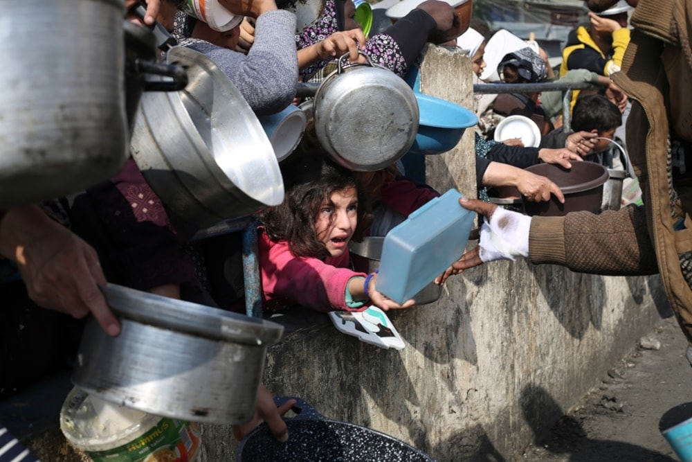 Palestinians line up for food during in Rafah, in the southern Gaza Strip, Palestine, on January 9, 2024. (AP)