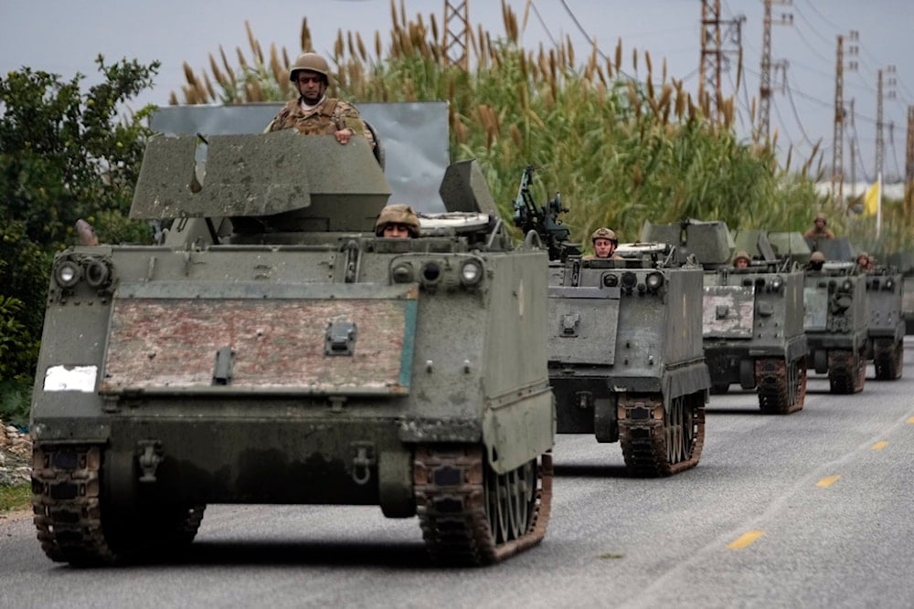 Lebanese soldiers ride in a convoy in Mansouri, as they head to southern Lebanon, following a ceasefire between the Israeli occupation and Hezbollah that went into effect on Wednesday, November 27, 2024 (AP)