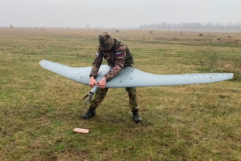 In this photo taken from a video released by Russian Defense Ministry press service on Wednesday, Nov. 27, 2024, a Russian serviceman operates a Supercam drone in an undisclosed location. (AP)