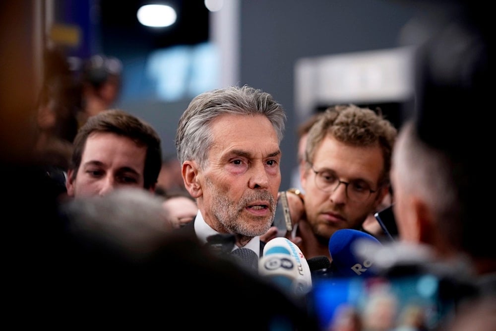 Netherland's Prime Minister Dick Schoof, center, speaks with journalists during an EU Summit at the Puskas Arena in Budapest, Hungary, Friday, Nov. 8, 2024. (AP)