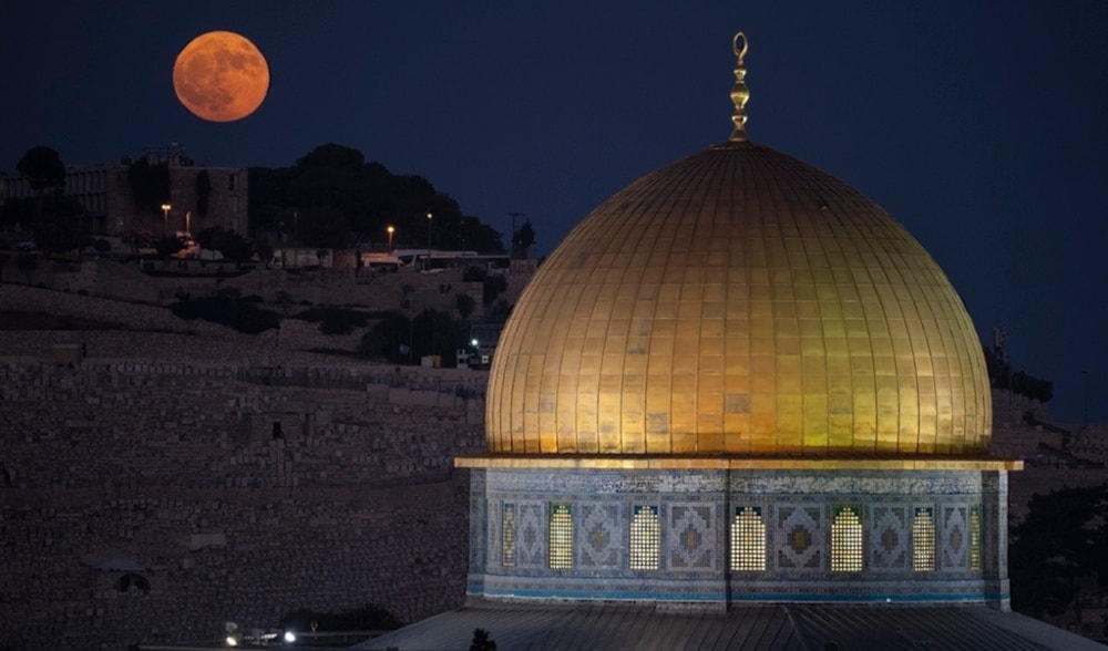 The supermoon rises behind the Al Aqsa Mosque compound in the Old City of al-Quds, Palestine, August 19, 2024. (AP)