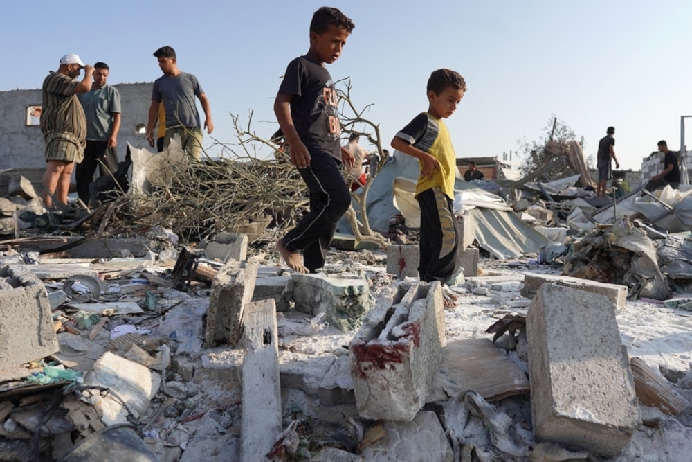 Palestinians inspect the damage following Israeli bombardment on Khan Younis in the southern Gaza Strip on August 27, 2024. (AFP)