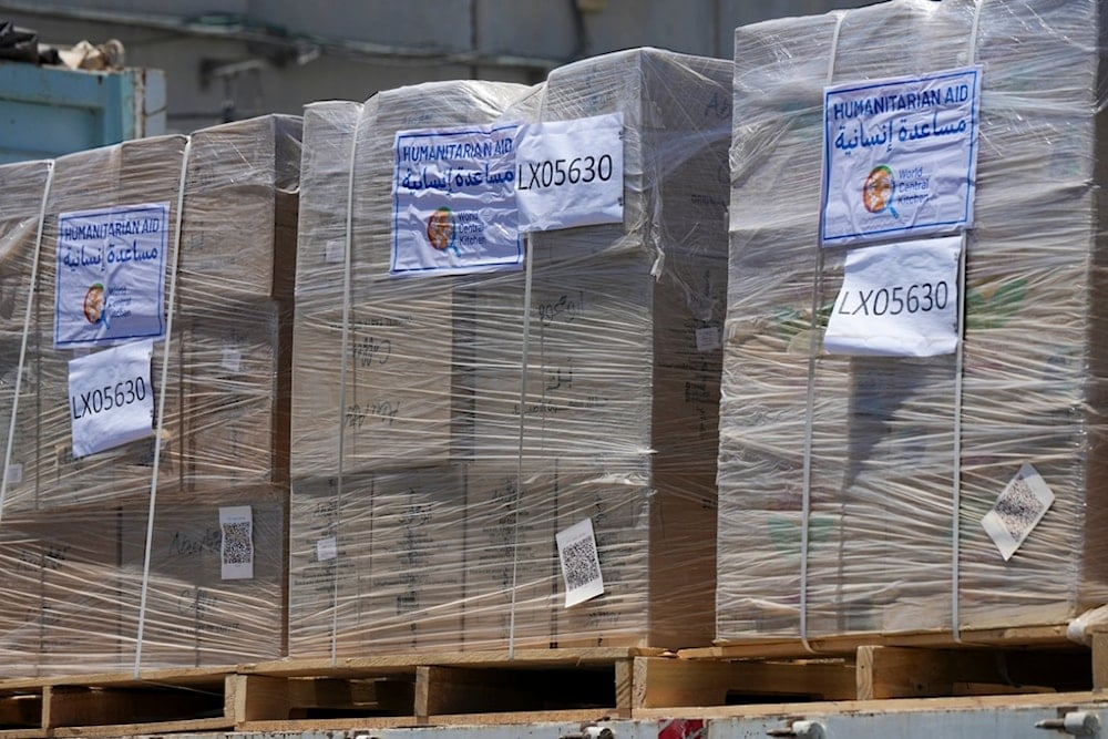 A bundle of humanitarian aid for the Gaza Strip with the logo of World Central Kitchen (WCK) is seen at the Kerem Abu Salem border crossing in southern occupied Palestine, Thursday, May 30, 2024 (AP)