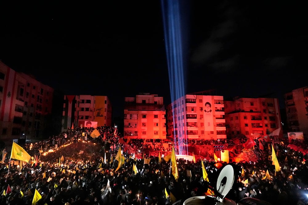 People gather at the site where former Hezbollah leader Sayyed Hassan Nasrallah was killed by Israeli airstrikes late September during a memorial ceremony in the southern suburb of Beirut, Lebanon, Saturday, November 30, 2024  (AP)