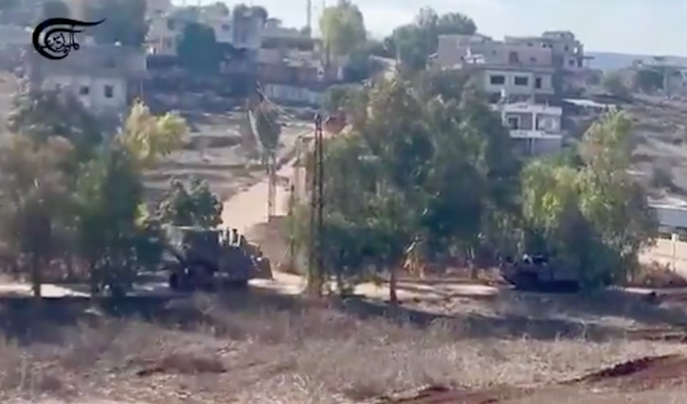 Two Israeli military vehicles seen in Aitaroun, South Lebanon, November 30, 2024 (Screen Grab)