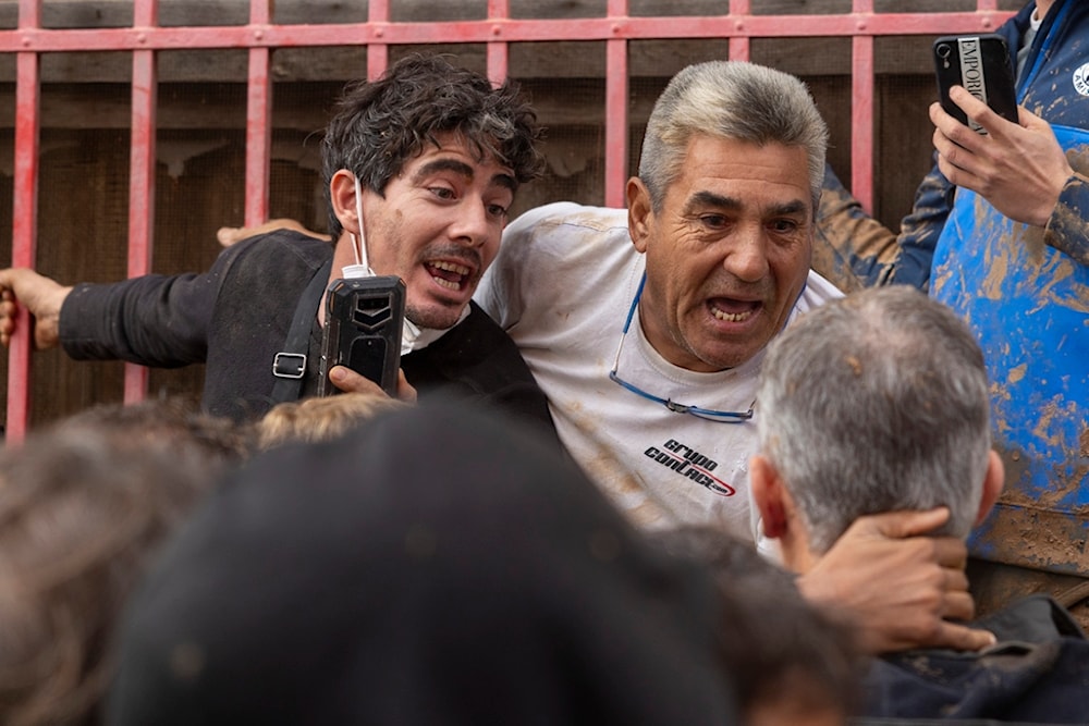 Angry Spanish flood survivors confront King Felipe VI in the devastated town of Paiporta, near the city of Valencia, on November 3, 2024 (AP)