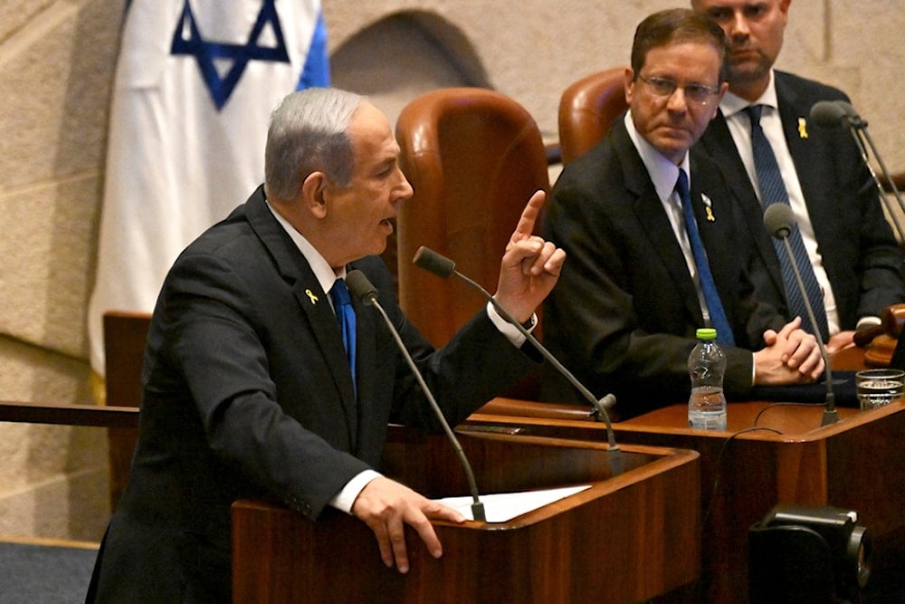 Israeli Prime Minister Benjamin Netanyahu speaks at the opening of the 25th Knesset session in occupied al-Quds, occupied Palestine, Monday, October 28, 2024 (AP)