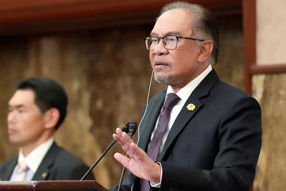 Malaysian Prime Minister Anwar Ibrahim delivers his speech during a press conference at Japan National Press Club in Tokyo on May 24, 2024. (AP)