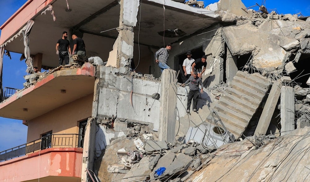 People search for victims at a destroyed building hit in an Israeli occupation airstrike, in Ghaziyeh town, south Lebanon, Nov. 3, 2024. (AP)