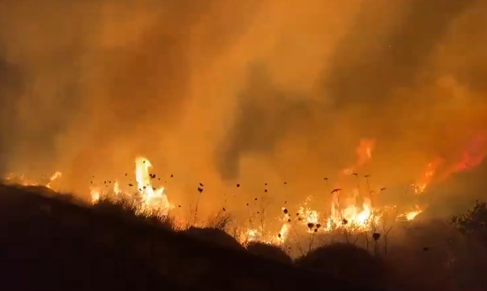 A screengrab from a video shared by israeli settlers showing the fires resulting from Hezbollah operations in Upper al-Jalil on June 4, 2024. (Social media) 