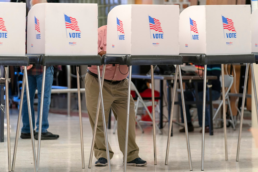 People cast their ballot during Election Day 2024 at John F. Kennedy High School in Silver Spring Md, on November 5, 2024. (AP)