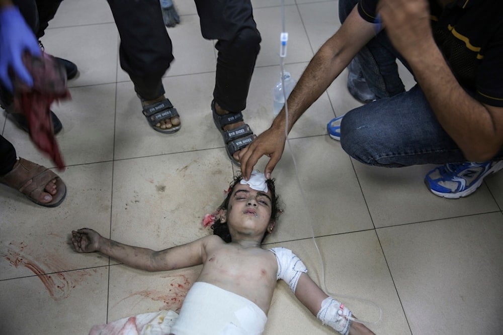 An injured Palestinian girl is treated at Al-Aqsa Martyrs Hospital in Deir al Balah, Gaza Strip, Friday, June 14, 2024. (AP)