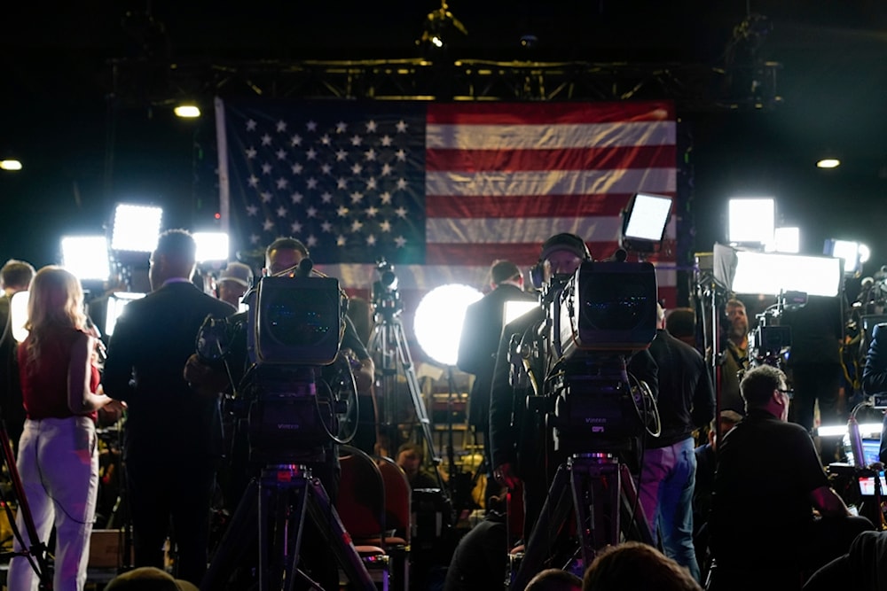 Members of media work at an election night campaign watch party for Republican presidential nominee former President Donald Trump Tuesday, November 5, 2024, in West Palm Beach, Florida 