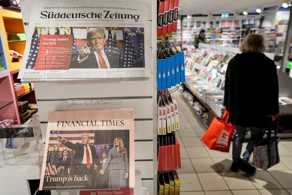 Newspapers front-pages with President-elect Donald Trump are seen at a station kiosk in Cologne, Germany, Thursday, Nov. 7, 2024. (AP Photo/Martin Meissner)