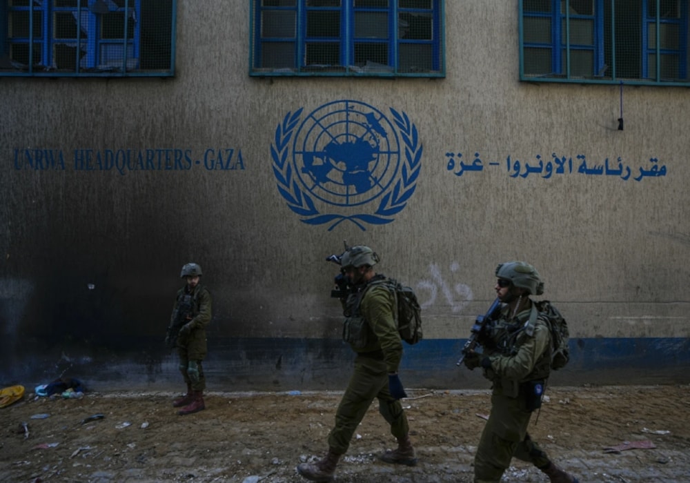  IOF take positions as they invade the UNRWA headquarters in Gaza on Feburary 8,2024. (AP)