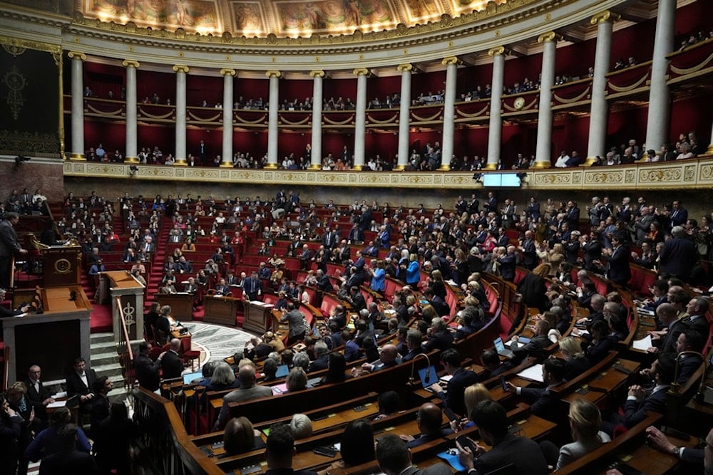 Lawmakers convene at the National Assembly during a debate on Wednesday, Dec. 4, 2024 in Paris. (AP Photo/Michel Euler)