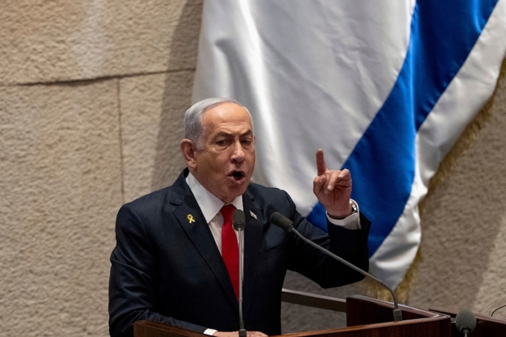 Israeli Prime Minister Benjamin Netanyahu addresses lawmakers in the Knesset in occupied al-Quds, on Monday, November 18,2024. (AP)