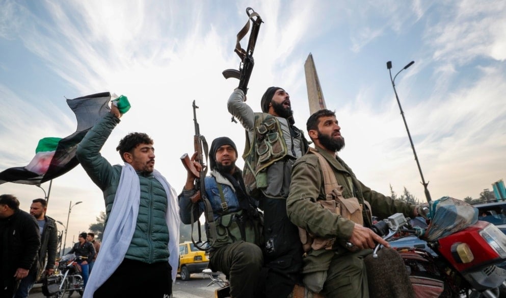 Syrian opposition fighters celebrate after the Syrian government collapsed in Damascus, Syria, Sunday, Dec. 8, 2024. (AP)