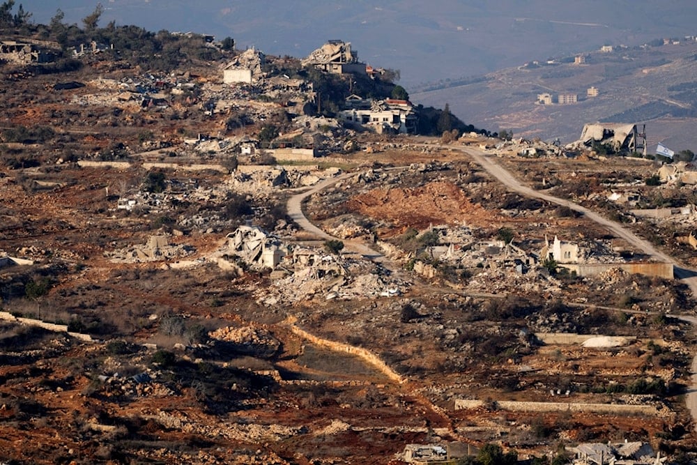 Destroyed buildings in the village of Kfar Kila, southern Lebanon, are seen from northern Israel, Dec. 3, 2024. (AP Photo/Maya Alleruzzo)