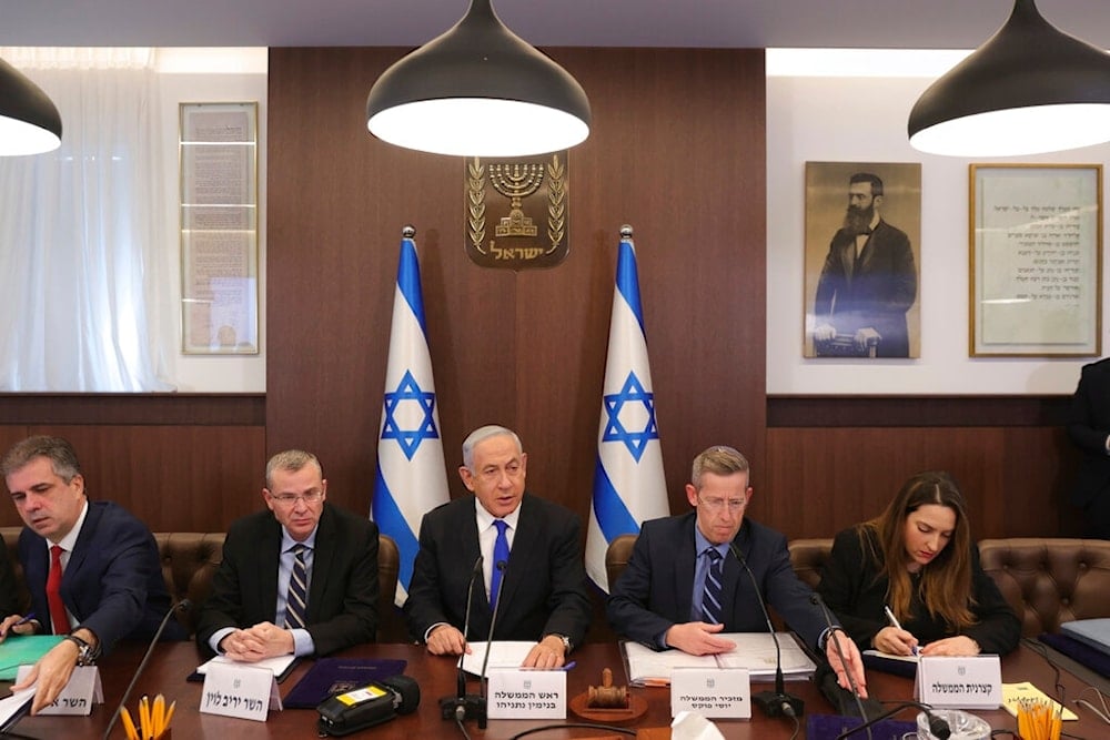 Israeli Prime Minister Benjamin Netanyahu attends the weekly cabinet meeting in the prime minister's office in al-Quds, February 19, 2023 (AP)