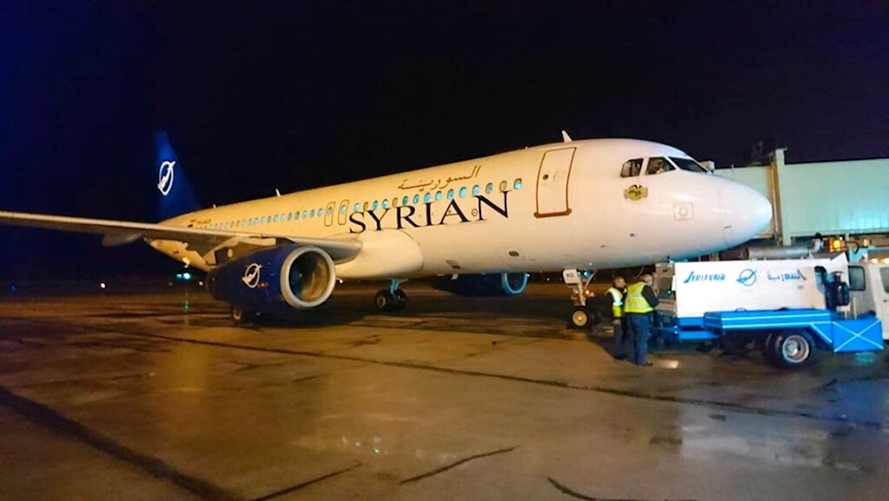 In this photo released by the Syrian official news agency SANA, a Syrian commercial plane coming from Lebanon, lands at Aleppo Airport, Syria, early Friday, January 15, 2021 (SANA via AP)